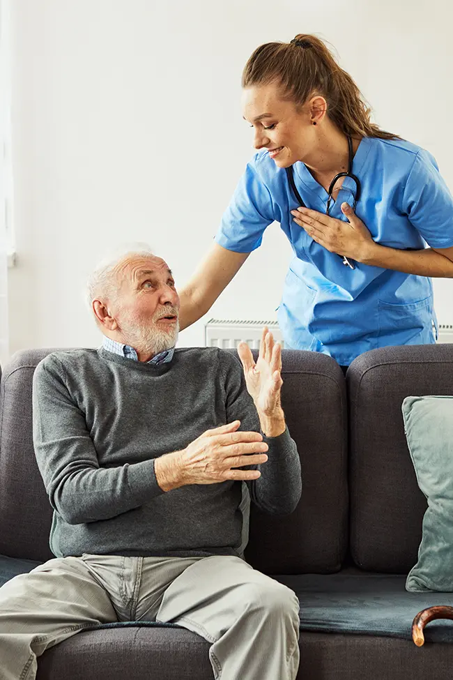 A caregiver assisting a patient with daily tasks.