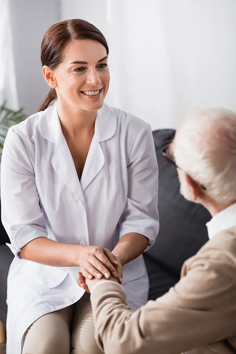 A nurse preparing to administer an injection to a patient.