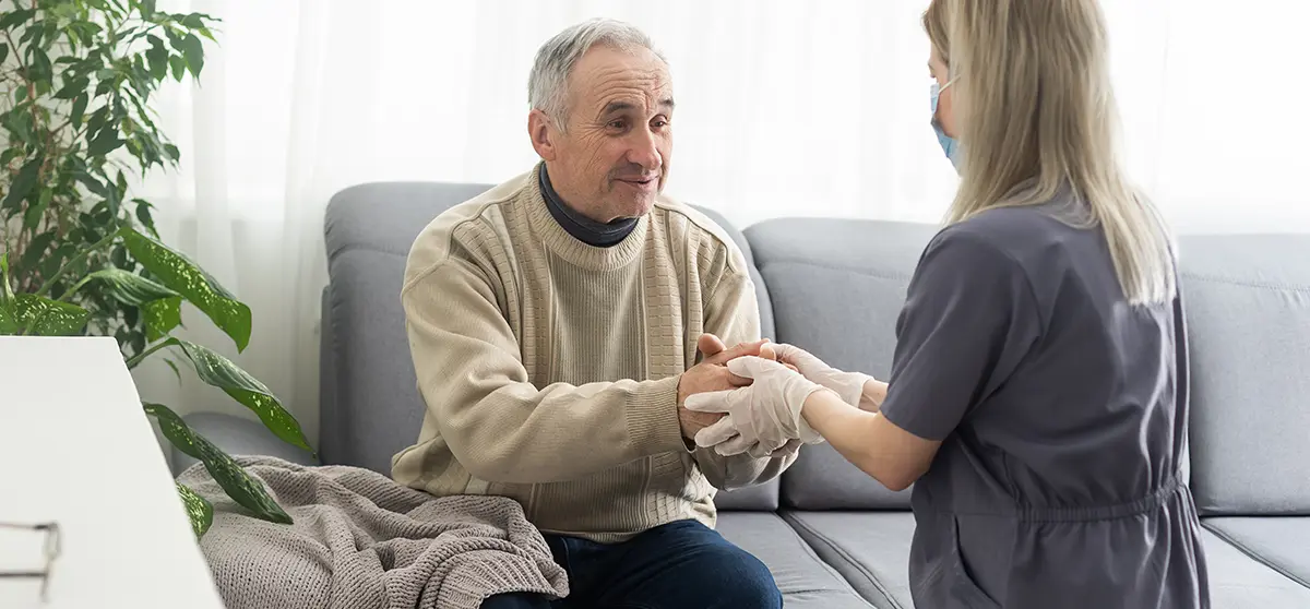 A social worker counseling a family at home.